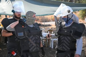 Workers of the Israel National Mine Action Authority (INMAA) searching for landmines