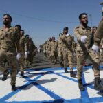 Iranian soldiers trample Israeli flag