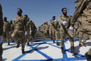 Iranian soldiers trample Israeli flag