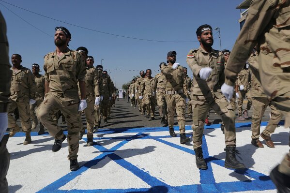 Iranian soldiers trample Israeli flag