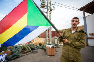 IDF soldier waving Druze flag