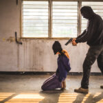 Terrorist with hostage (Shutterstock)
