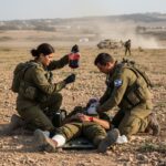 Medics treating soldier