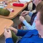 Holocaust survivors knitting hats