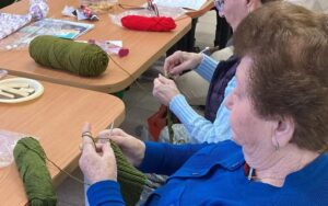 Holocaust survivors knitting hats